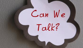 A white speech bubble with red text that says "can we talk?" on a gray background